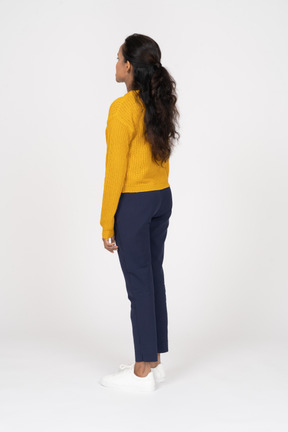 Side view of a girl in yellow shirt