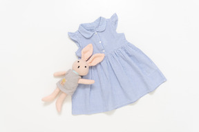 Kid girl's blue dress and stuffed toy