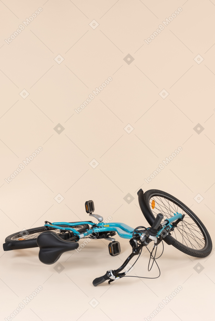 Blue bicycle left on the floor