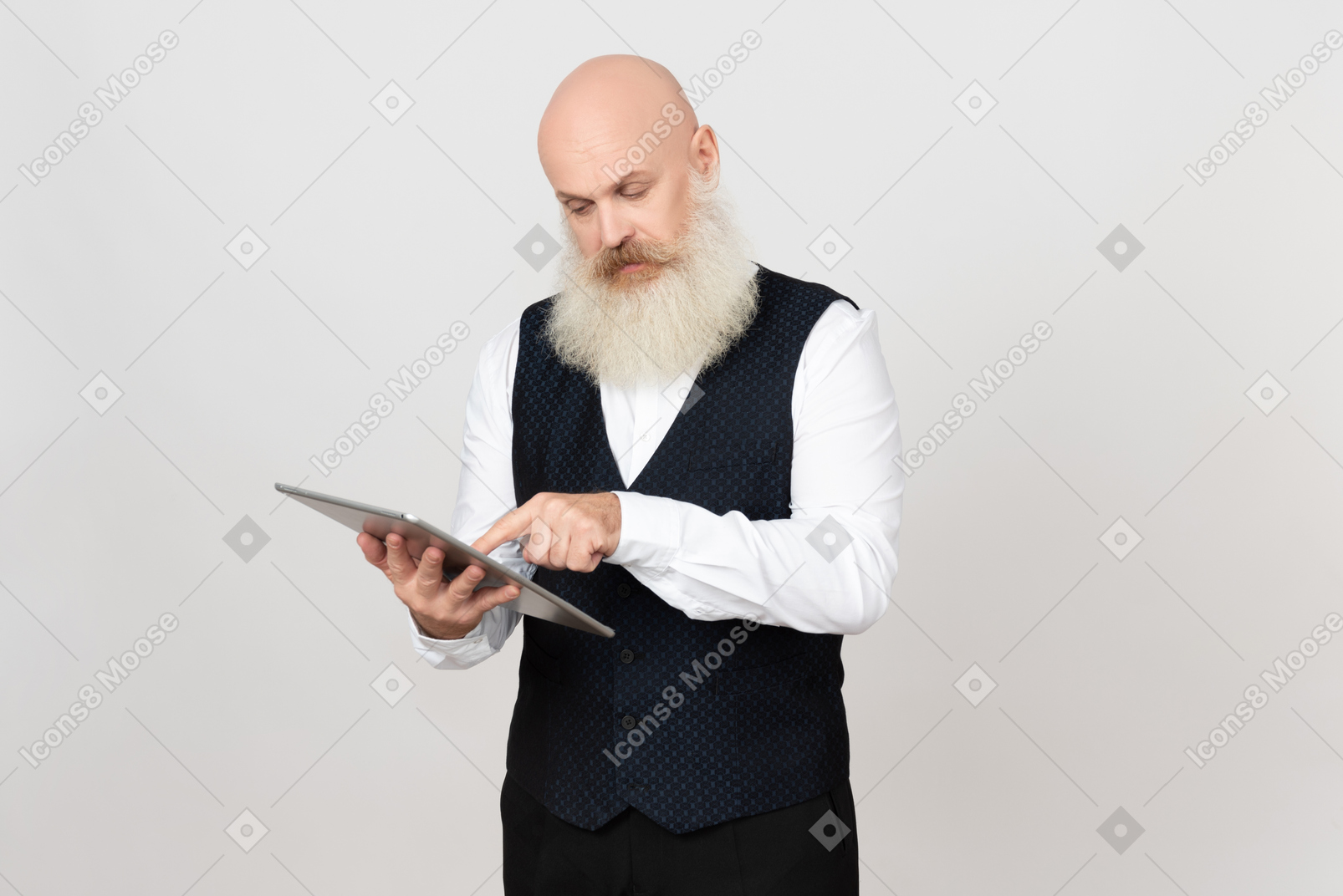 Aged man focused on using ipad