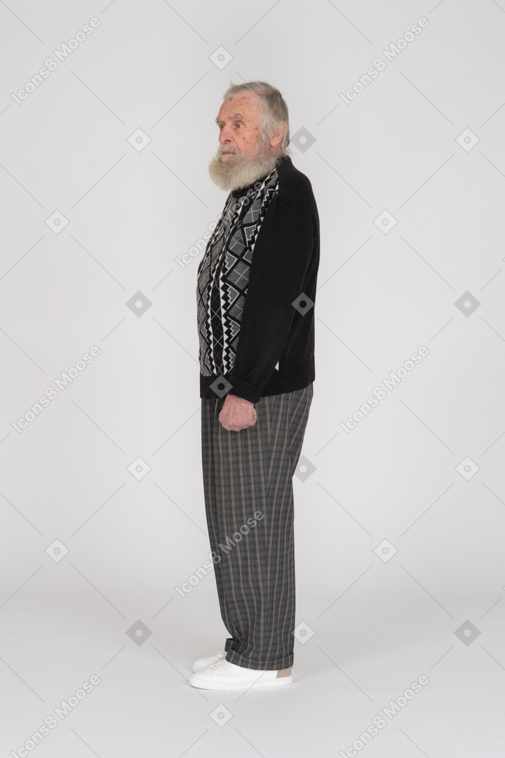 Side view of old man staring
