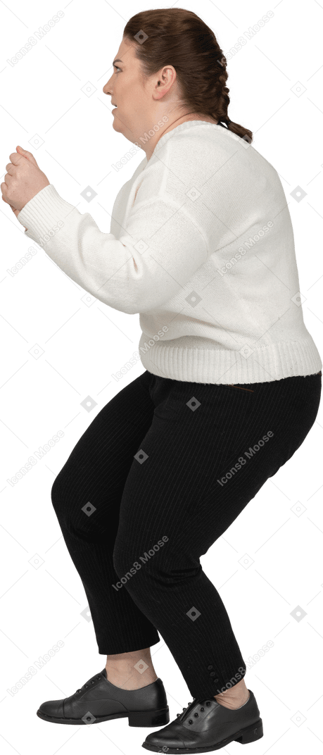 Plus size woman in casual clothes posing