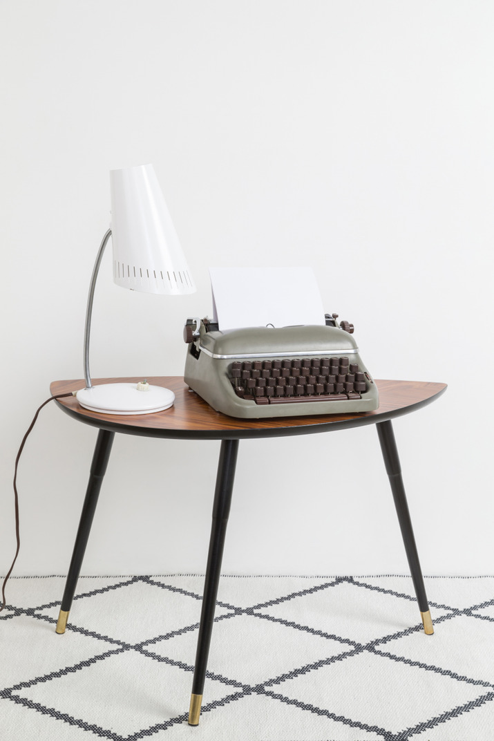Desk lamp, vintage typewriter on vintage coffeetable
