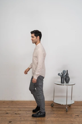 Man in casual clothes standing in profile