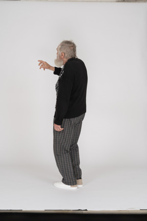 Side view of old man with raised arm