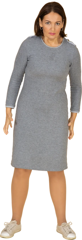 Front view of an angry woman in grey dress