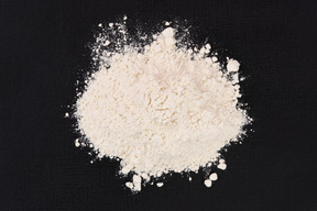 White flour on black background