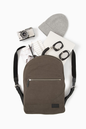 City backpack with laptop, headphones and photo camera