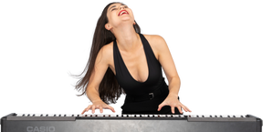 Front view of a young lady in black dress enjoying playing the piano