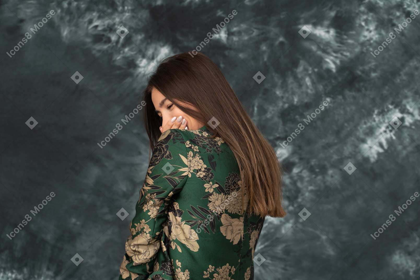 Back shot of young woman in japanese jacket laughing hides her mouth