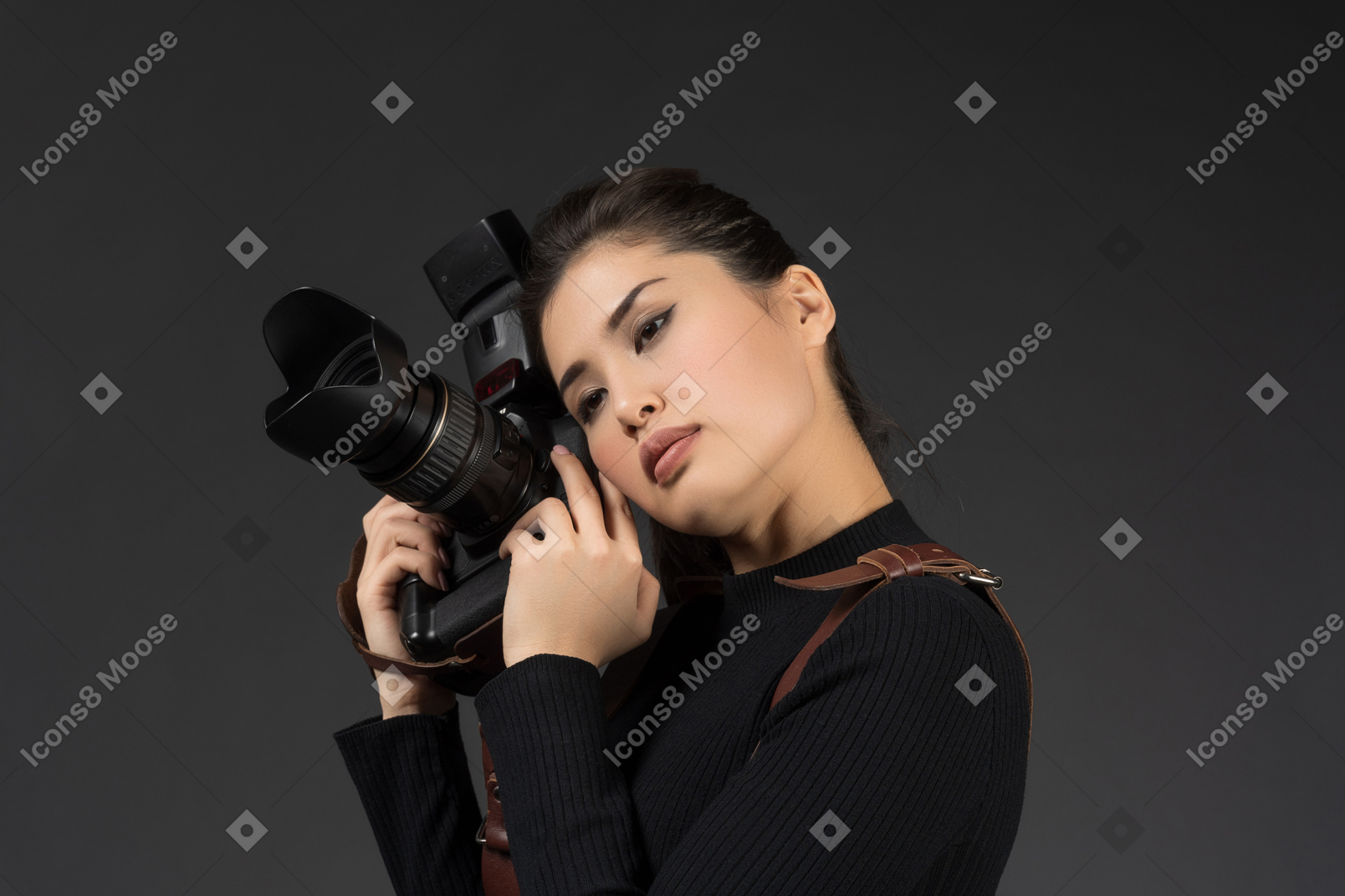 Pretty young woman posing with camera