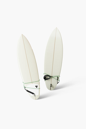 Two white surfboards on white background