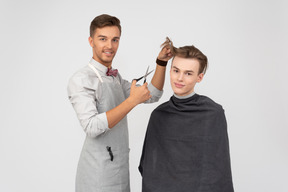 A young barber and his client