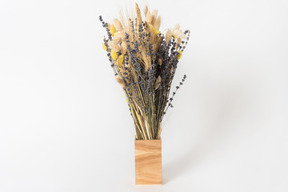 Dried flowers in wooden vase