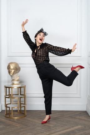 Portrait of a cheerful young woman bursting with joy