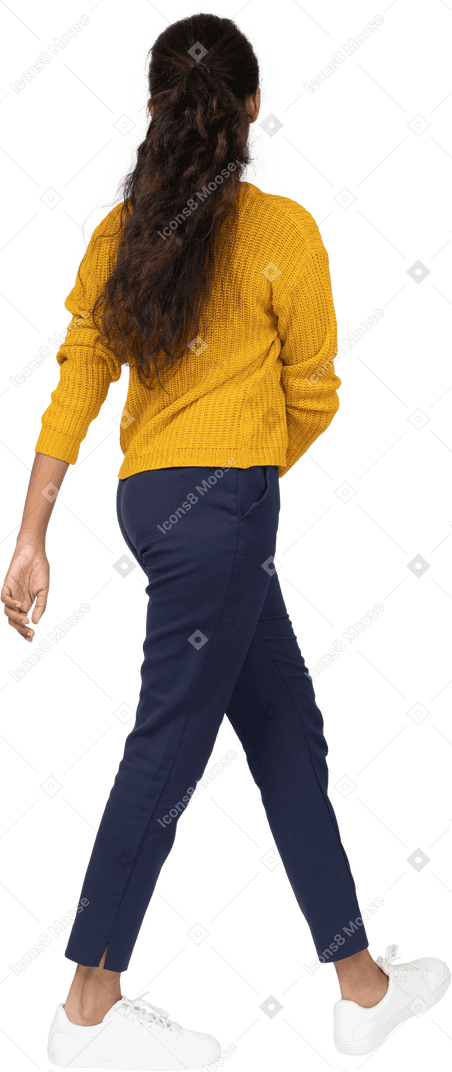 Side view of a girl in casual clothes walking
