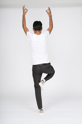 Man in white t-shirt doing yoga