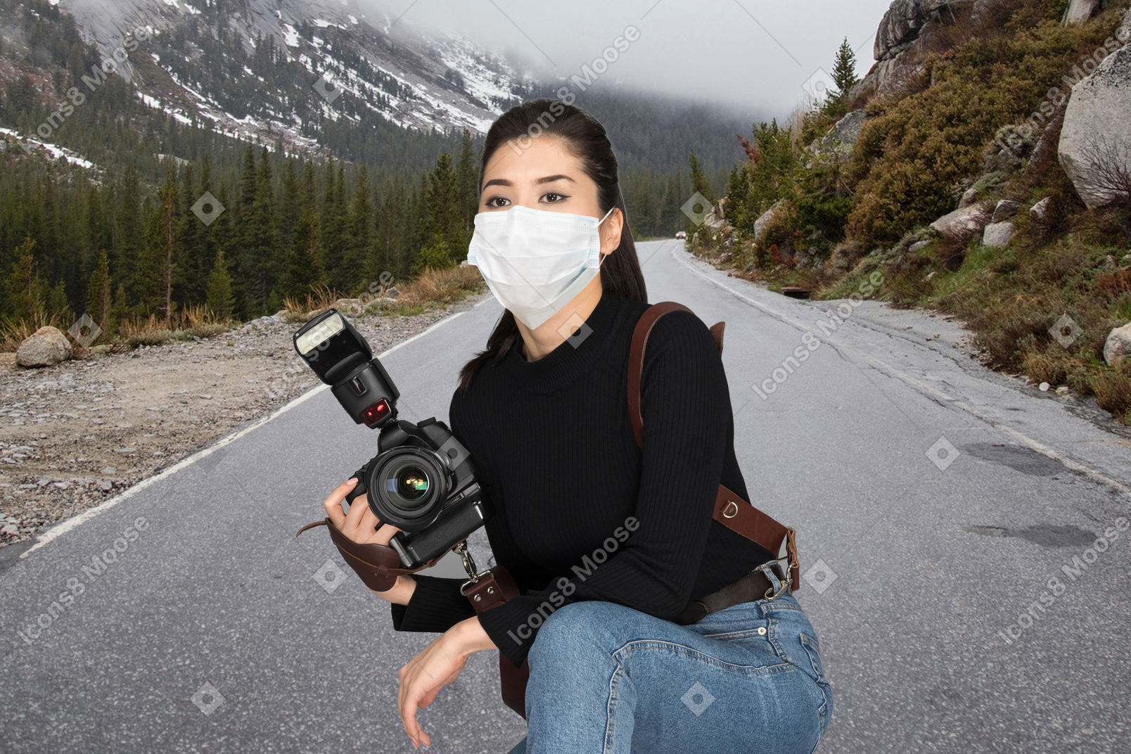 Woman taking a photo of mountains