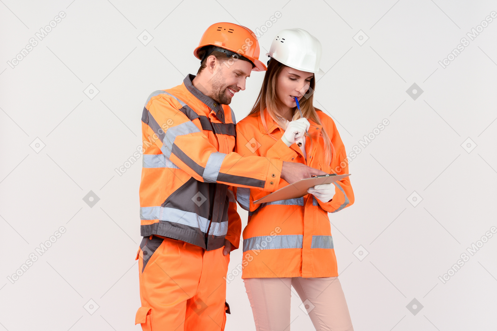 Female and male street workers looking at file and discussing it