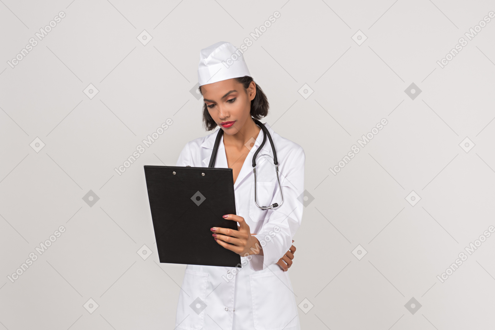 Attractive female doctor looking through some documents