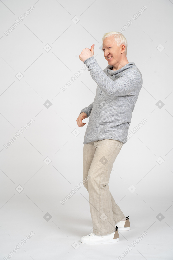 Man giving thumbs up and crouching
