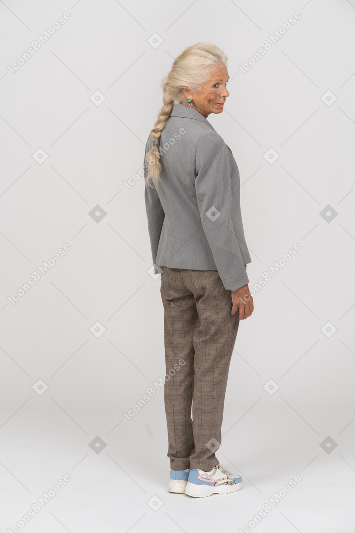 Rear view of an old woman in suit