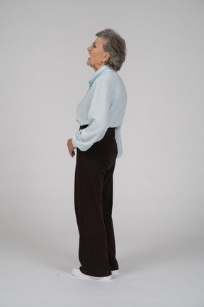 Side view of an old woman gaping to the left