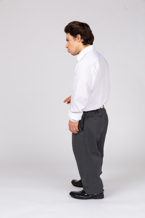 Side view of a young man in formalwear looking away