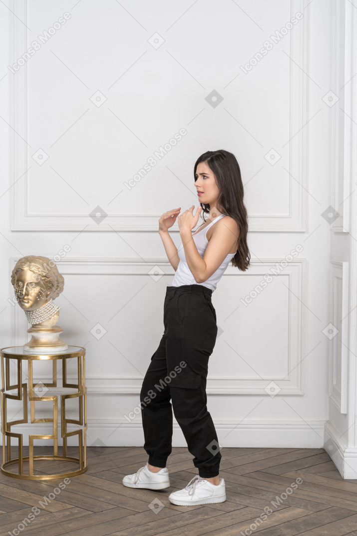 Young woman frowning and gesturing