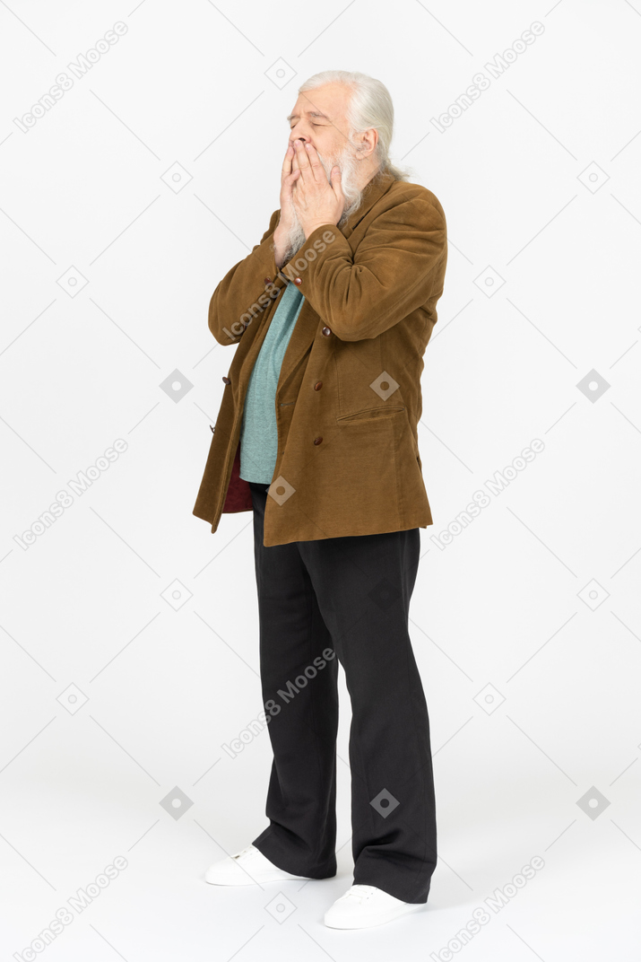 Elderly man covering his mouth with both hands