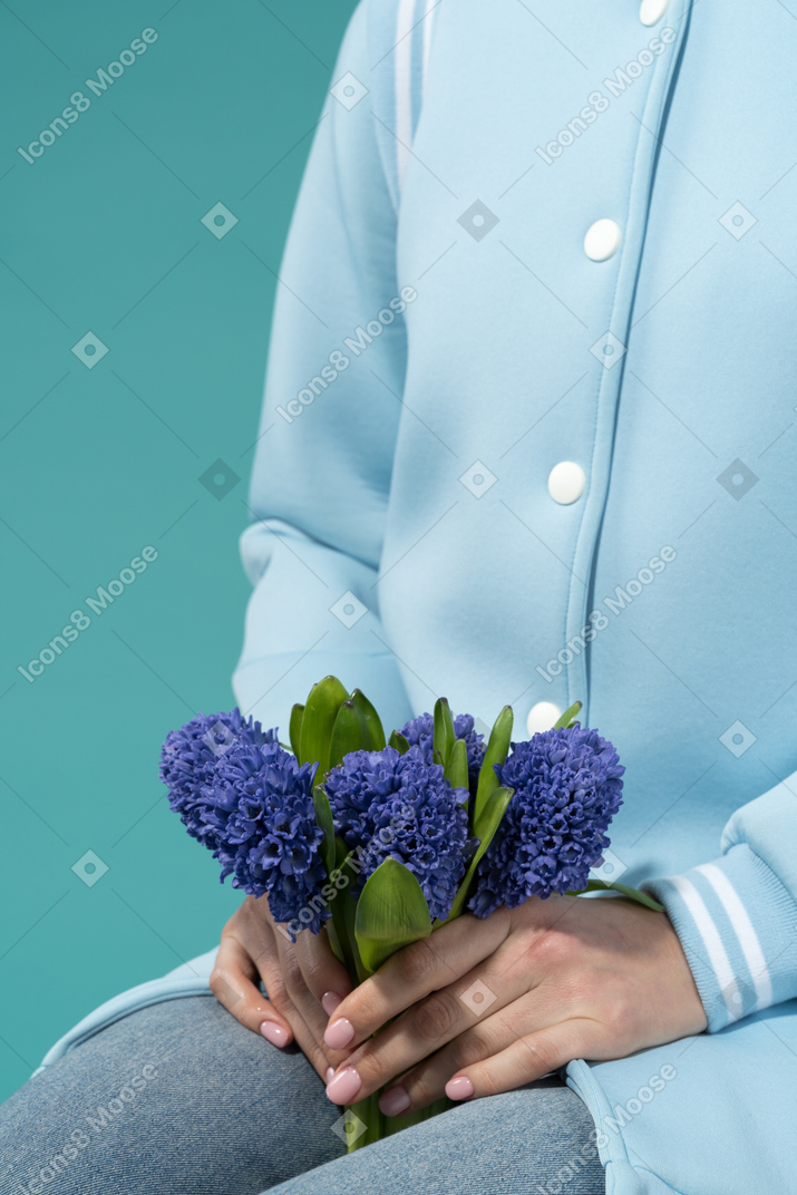 Woman holding a flower bouquet