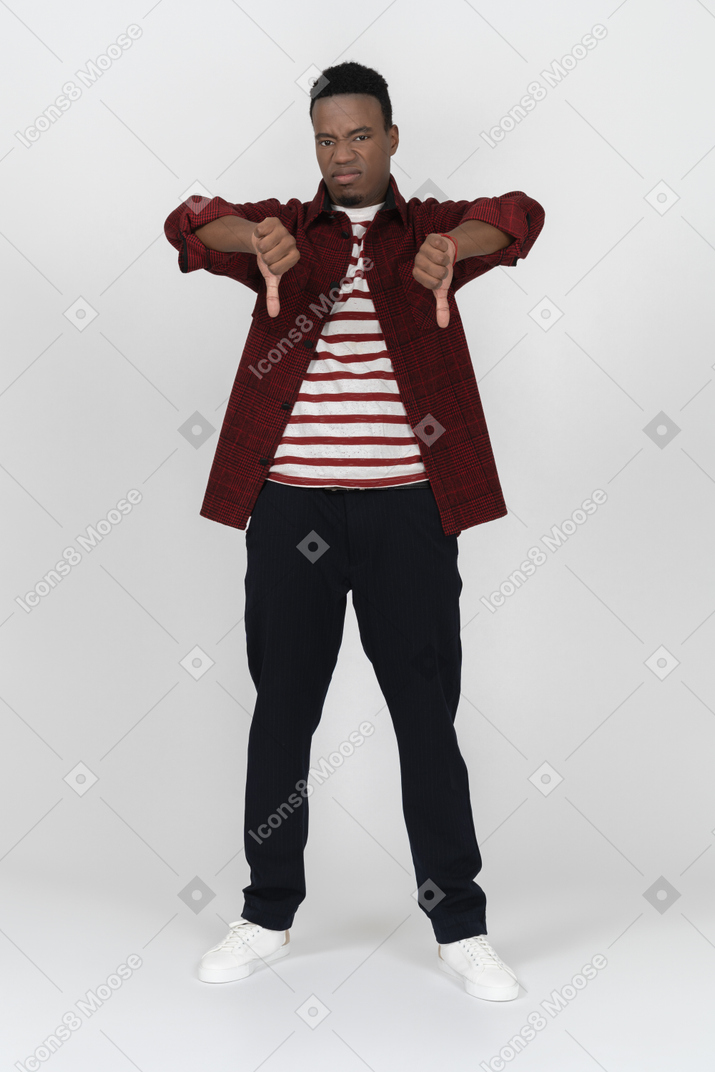 Young man giving thumbs down with two hands