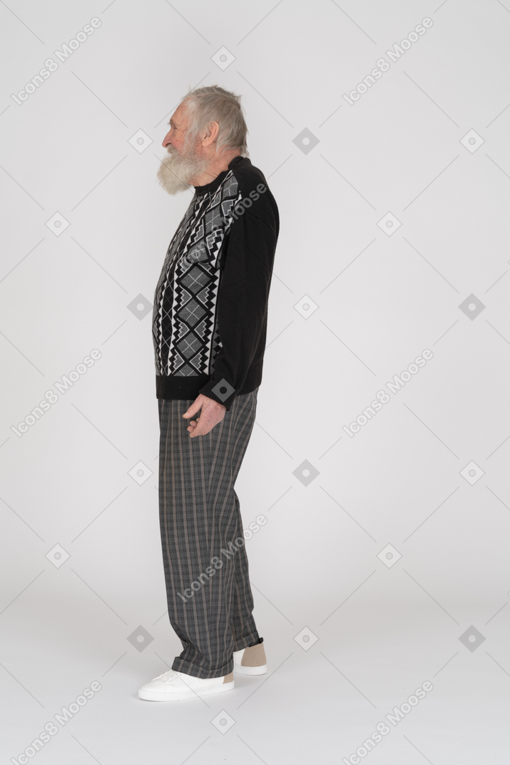 Side view of happy elderly man standing