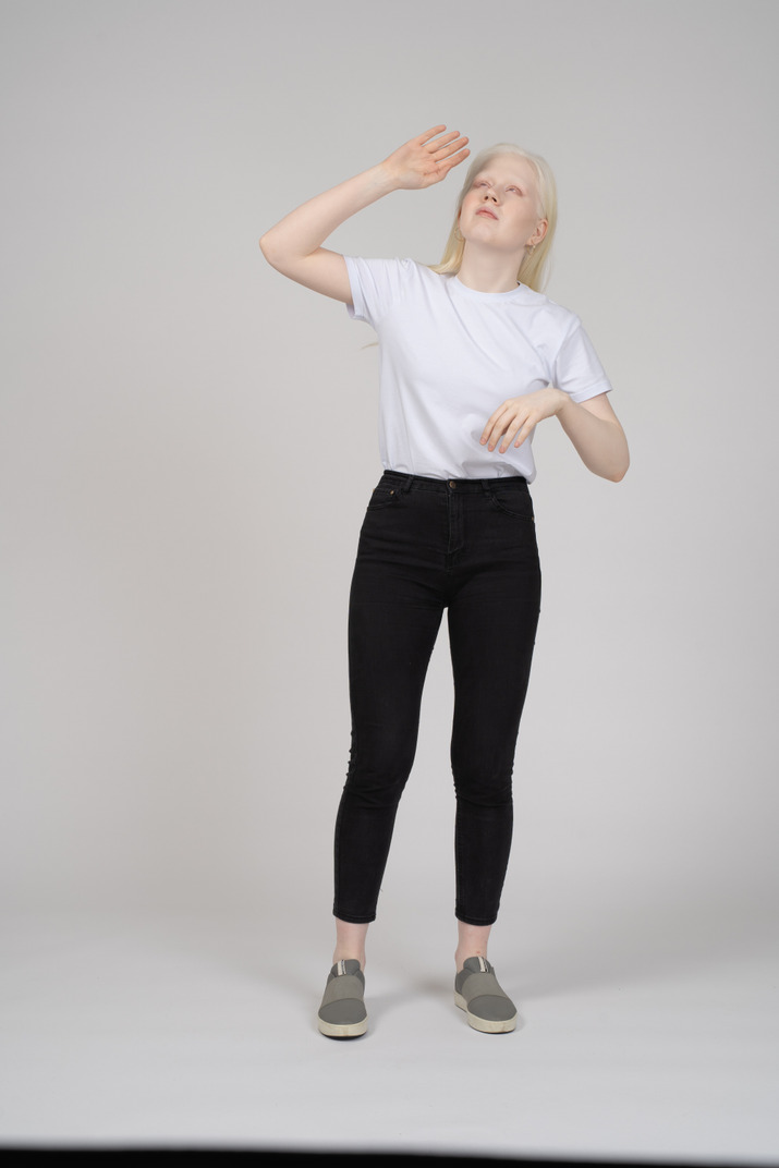 Girl covering face from sun Photo