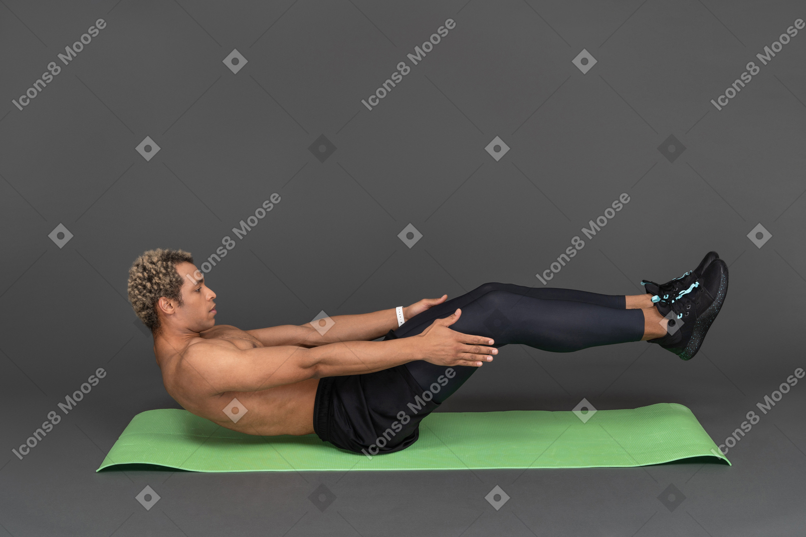 Side view of a shirtless afro man doing crunches