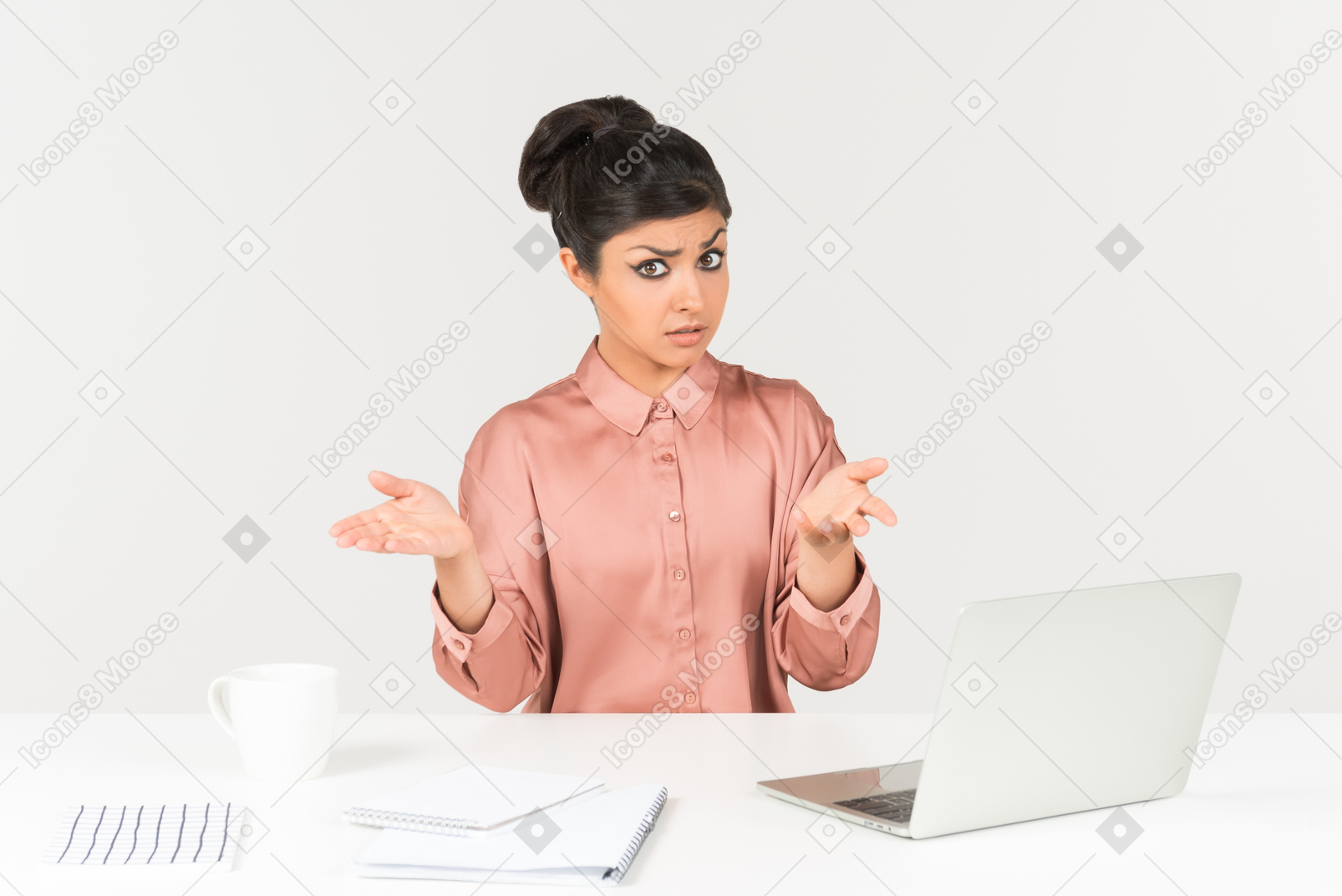 Not understanding something young indian woman sitting at the office desk