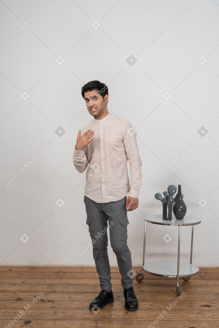 Front view of a man in casual clothes gesturing