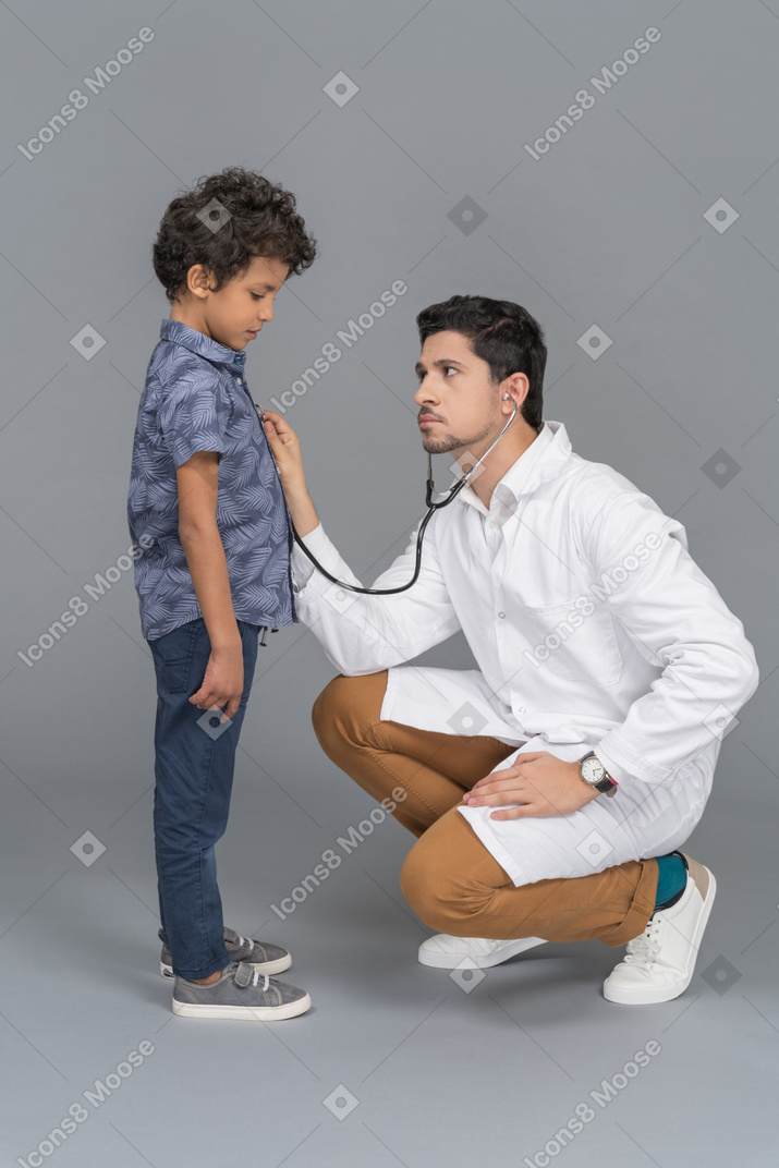Ill boy and doctor