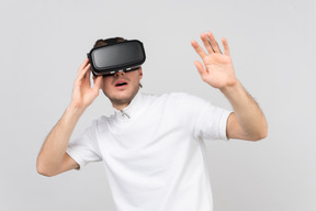 Impressed man in virtual reality headset