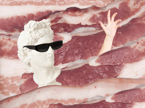 Statue on meat background