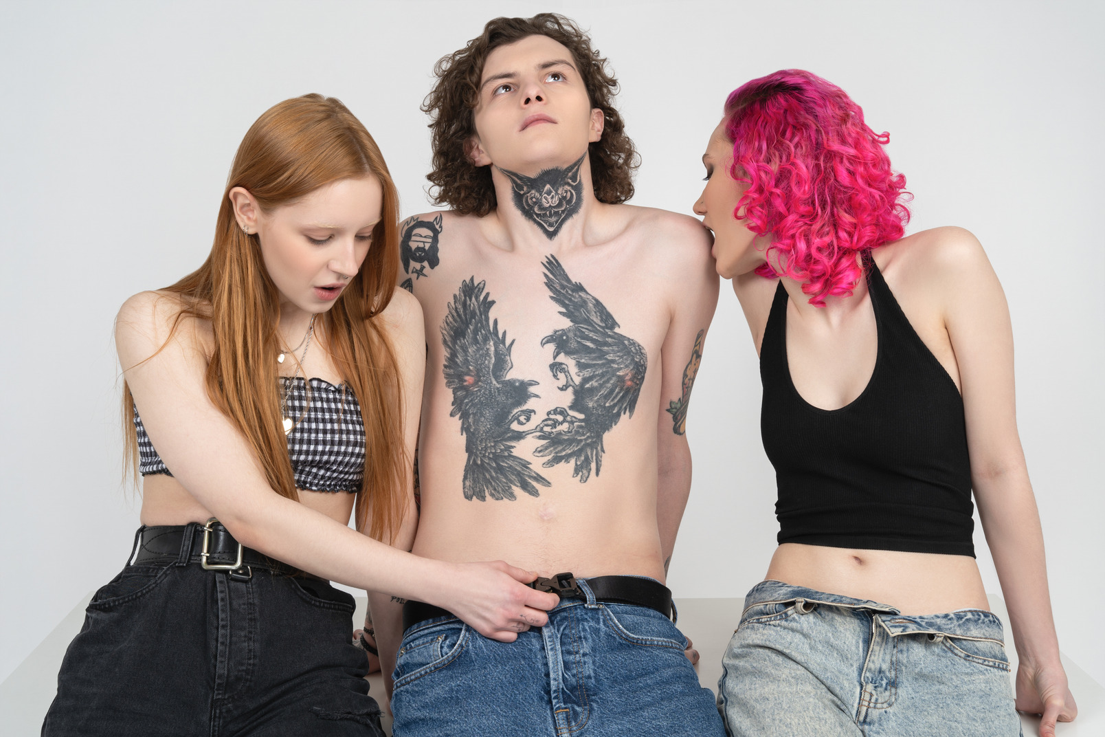 Young man surrounded by two passionate teenage girls