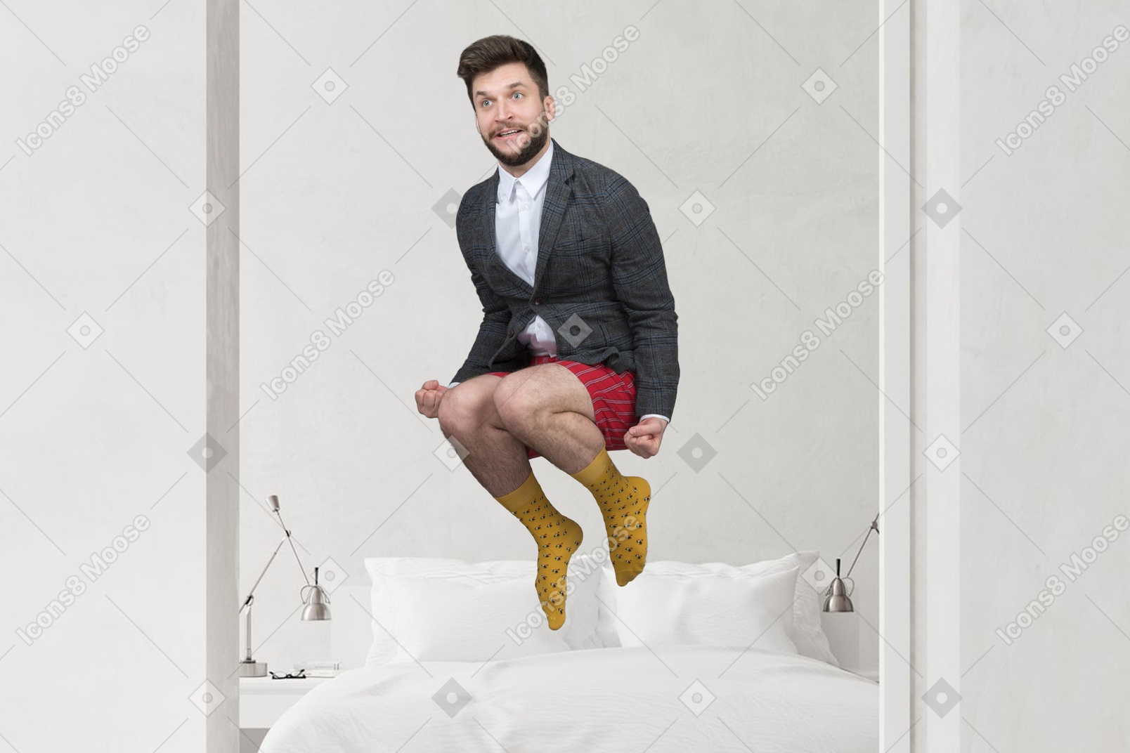A man jumping on a bed