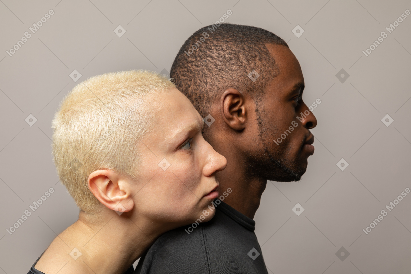 Young woman leaning her head on man's shoulder