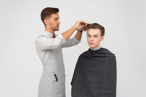 A young barber and his client