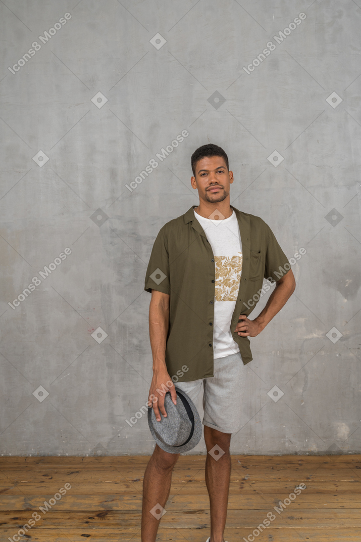 Man in casual clothes holding hand on hip