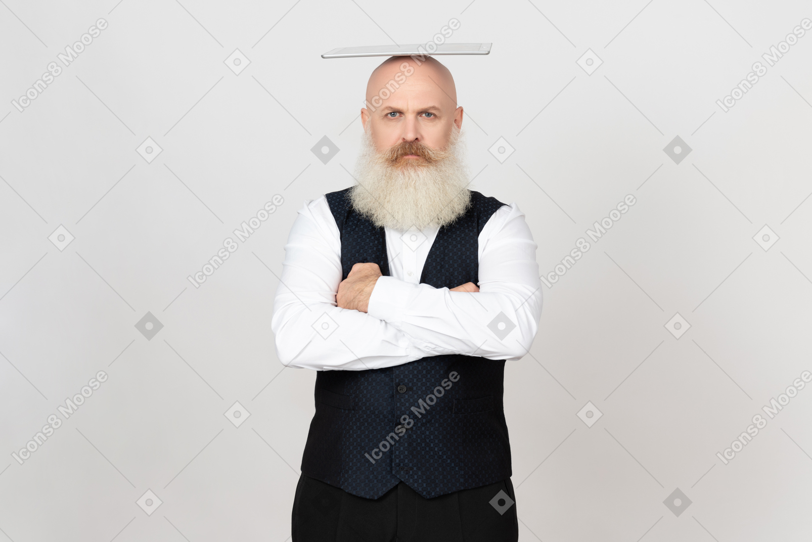 Aged man with his hands crossed holding digital tablet on head