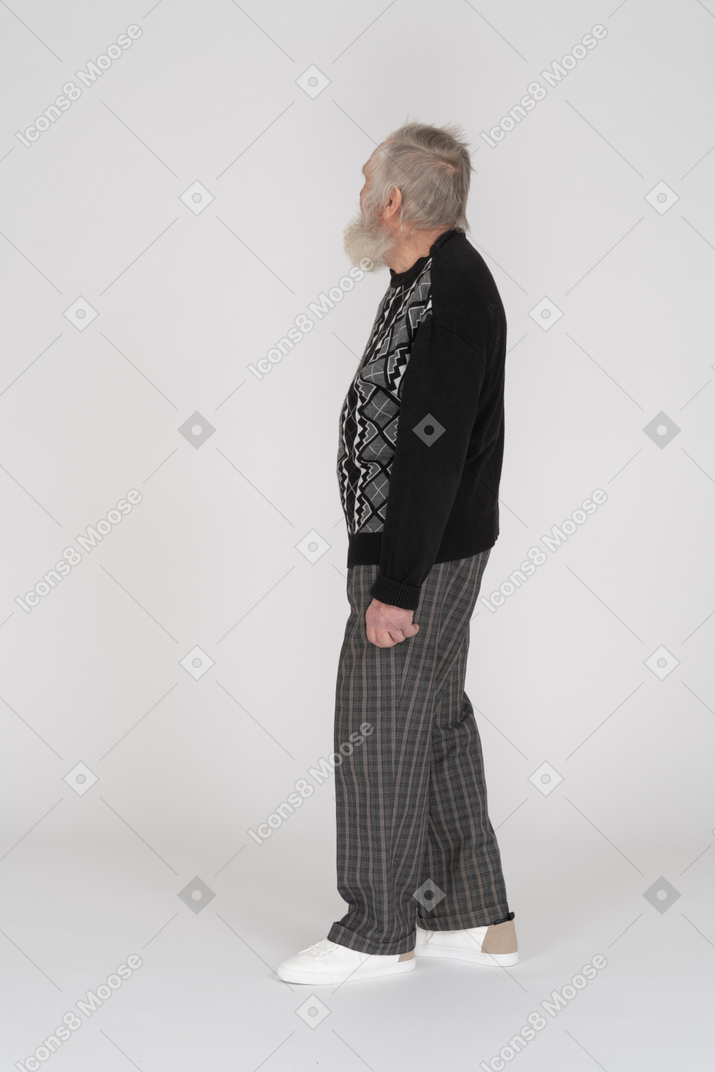 Side view of an old man looking up and away