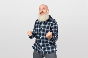 Bearded man with clenched fists
