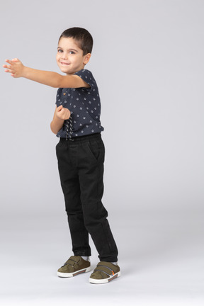 Front view of a cute boy showing direction