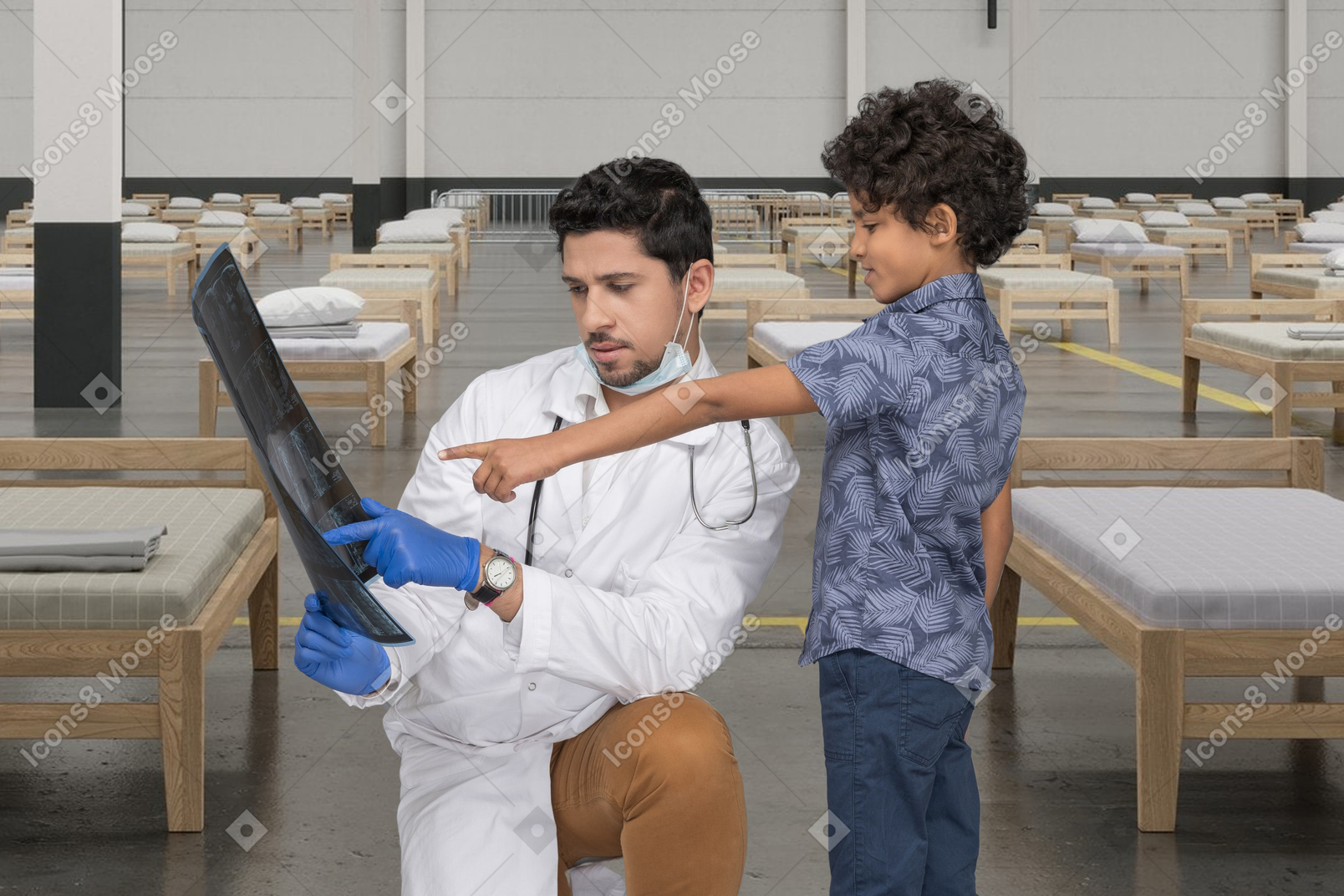 Doctor and his little patient examining a x-ray in a makeshift hospital
